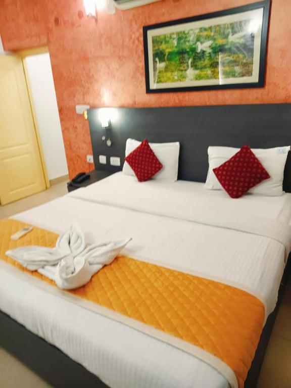 Postel nebo postele na pokoji v ubytování StayEasy Tiruvanmiyur (Unit of Prohotel)