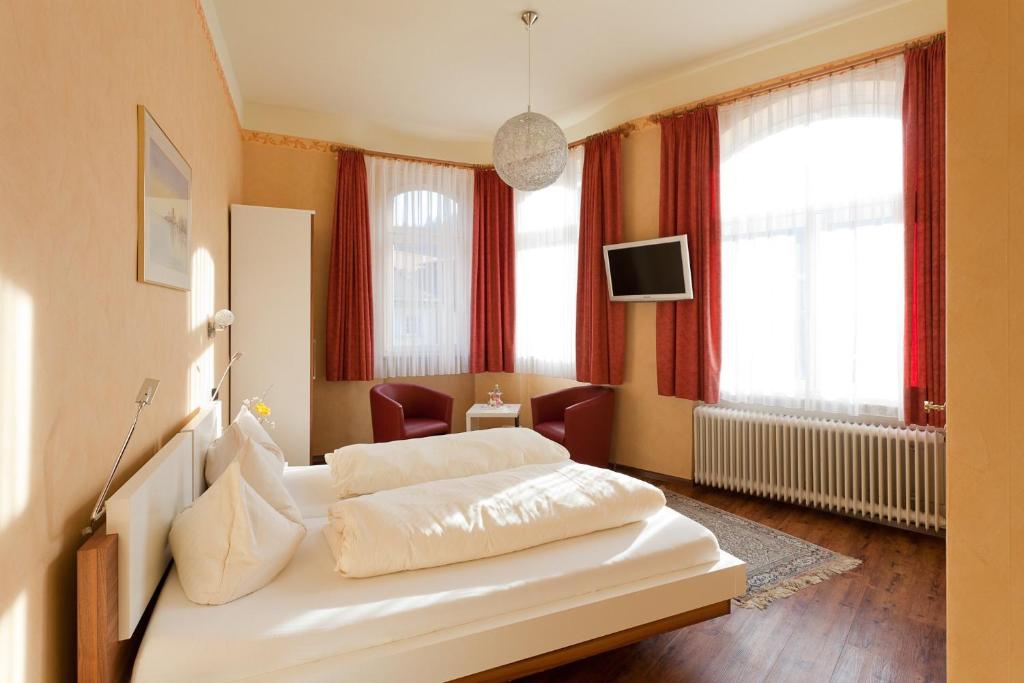 Postel nebo postele na pokoji v ubytování Hotel Kühler Krug