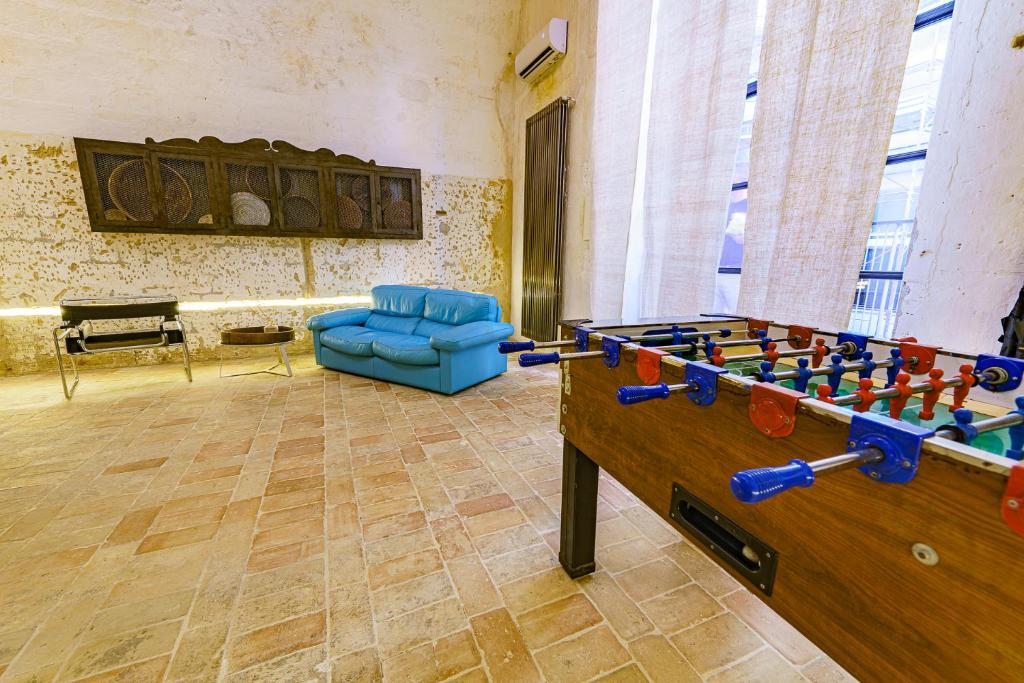 a room with a foosball table and a couch at Il Granile Contemporary Loft in Matera