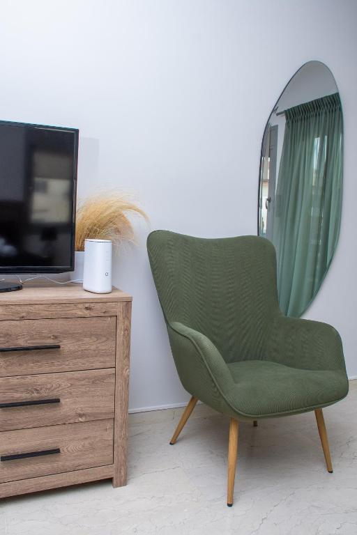 TV a/nebo společenská místnost v ubytování sweet suite
