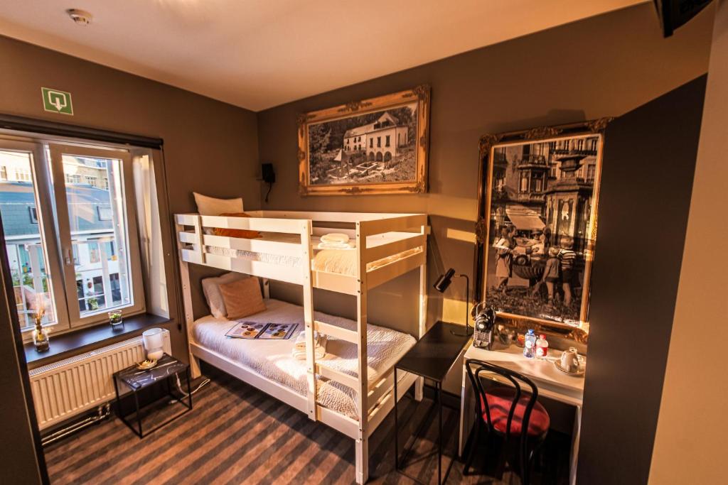Postel nebo postele na pokoji v ubytování Le Palmarès - Brasserie & Hôtels