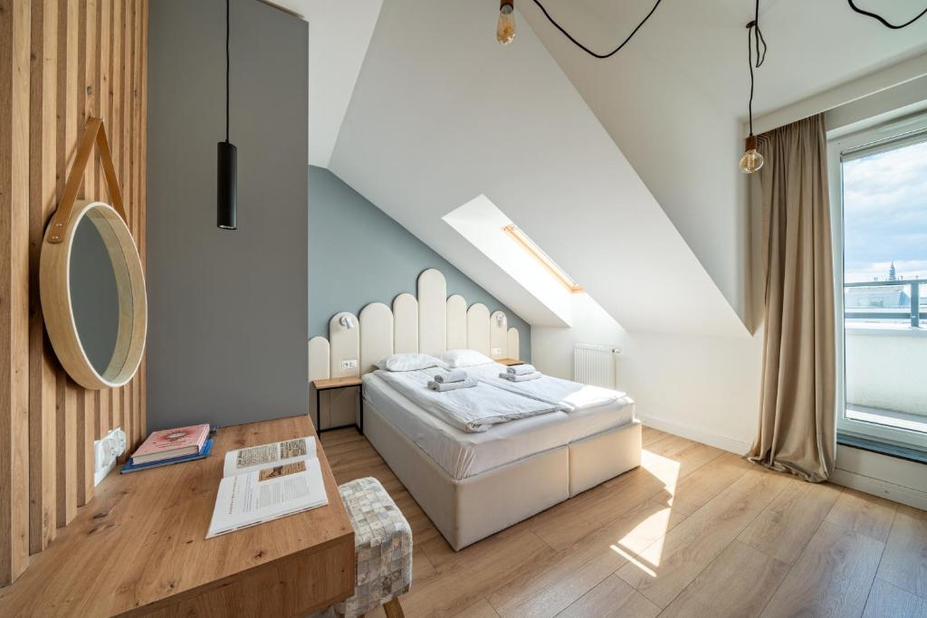 Posteľ alebo postele v izbe v ubytovaní Apartamenty Sun & Snow Angielska Grobla