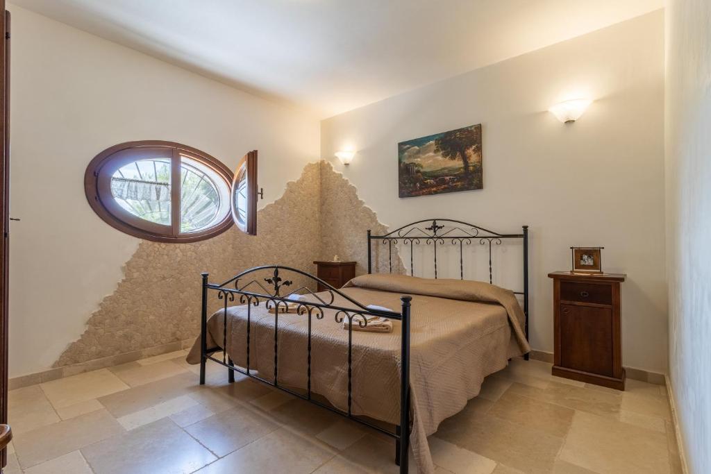 Posteľ alebo postele v izbe v ubytovaní Appartamento Arancio