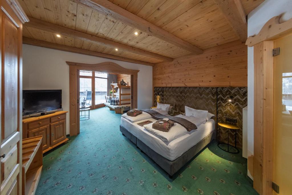 Postel nebo postele na pokoji v ubytování Panorama Resort Taljörgele