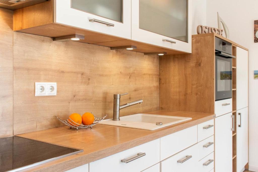 Kuchyň nebo kuchyňský kout v ubytování Ferienwohnung Windjammer