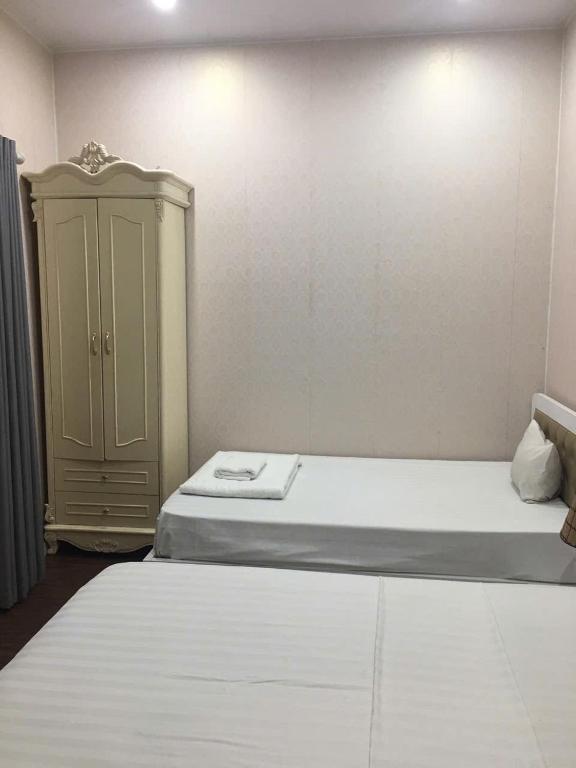Postel nebo postele na pokoji v ubytování Hanoi 0riental Hotel