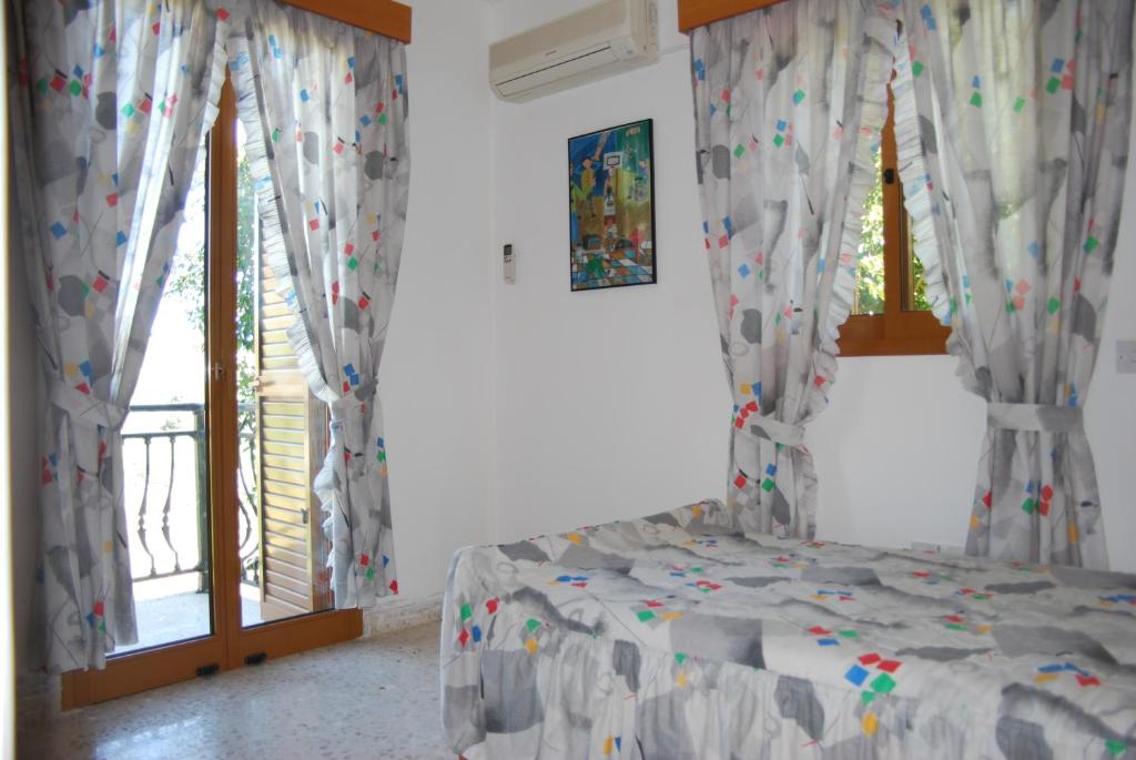 Postel nebo postele na pokoji v ubytování Zena Holiday Villa
