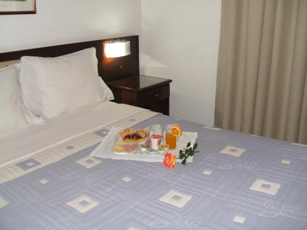 Postel nebo postele na pokoji v ubytování Hotel Boavista I