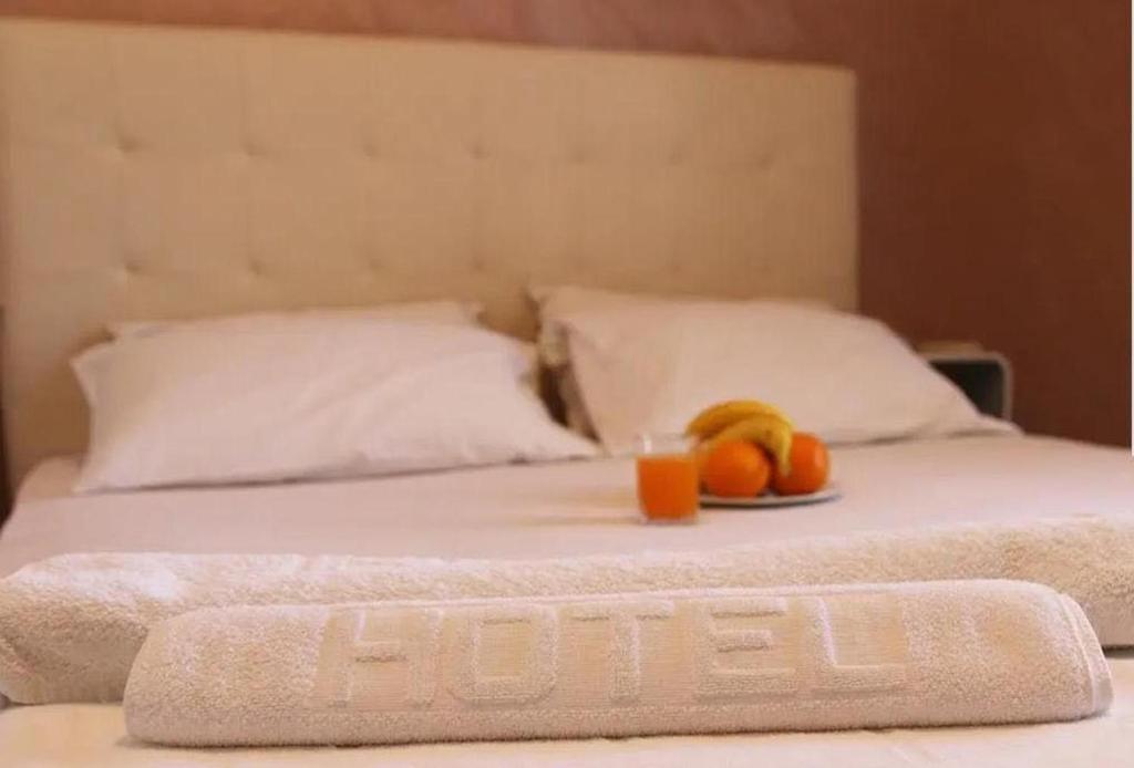 Postel nebo postele na pokoji v ubytování Hotel Biser