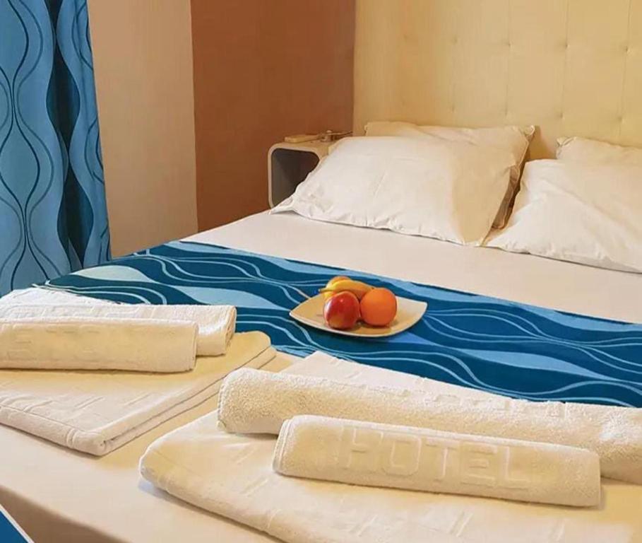 Postel nebo postele na pokoji v ubytování Hotel Biser