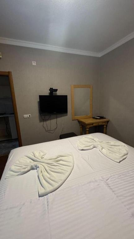 Postel nebo postele na pokoji v ubytování Hotel Biser