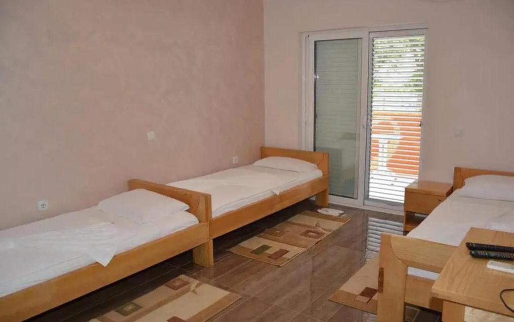 Postel nebo postele na pokoji v ubytování Hotel Biser