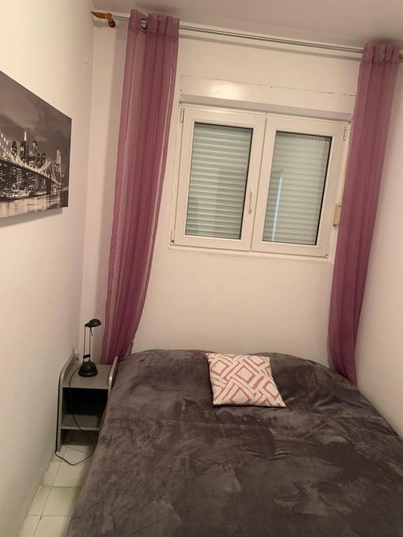 Postel nebo postele na pokoji v ubytování Apartment Milly