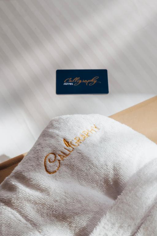 Postel nebo postele na pokoji v ubytování Boutique Hotel Calligraphy