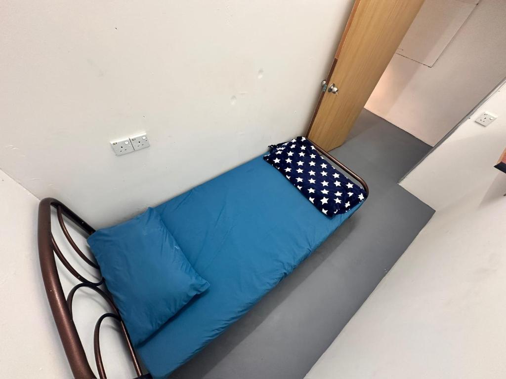 Voodi või voodid majutusasutuse Jiaxin Dormitory - Puteri Wangsa 家馨旅舍 toas