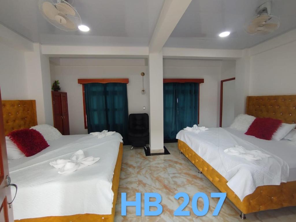 Postel nebo postele na pokoji v ubytování Hotel Glorial