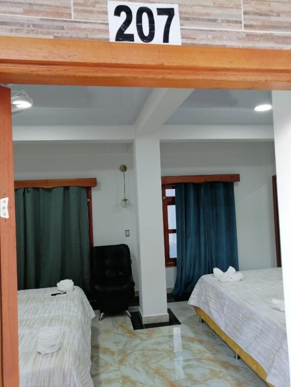 Postel nebo postele na pokoji v ubytování Hotel Glorial