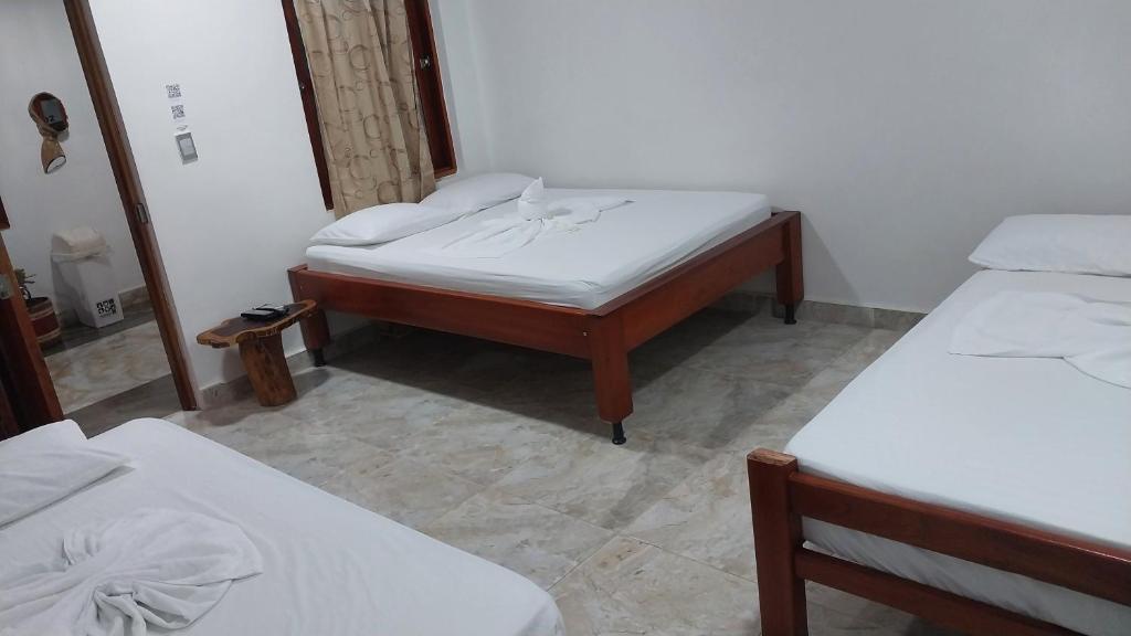Postel nebo postele na pokoji v ubytování Hotel Glorial