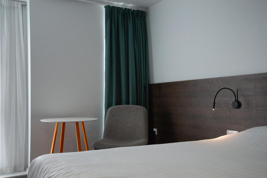 Postel nebo postele na pokoji v ubytování Sunley Hotel