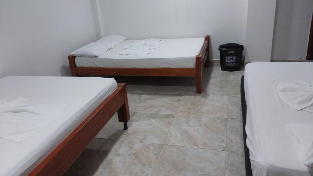 Postel nebo postele na pokoji v ubytování Hotel Glorial