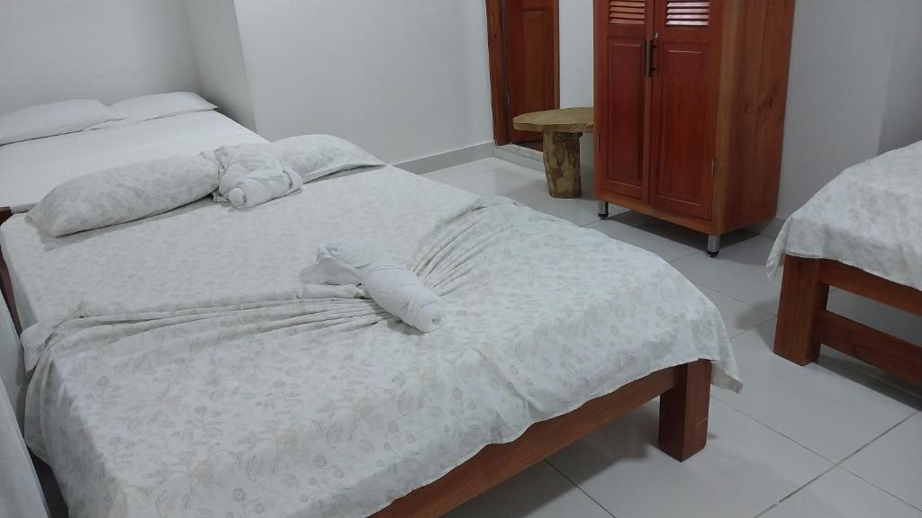 Postel nebo postele na pokoji v ubytování Hotel Glorial