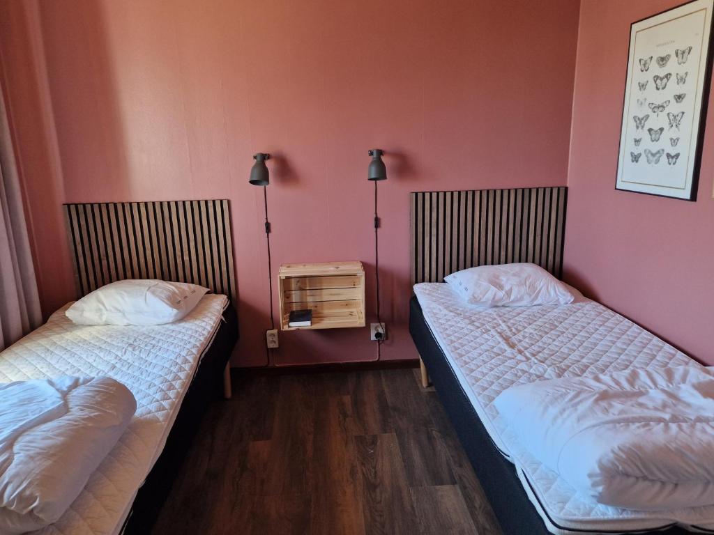 Postel nebo postele na pokoji v ubytování Storstrand Kursgård