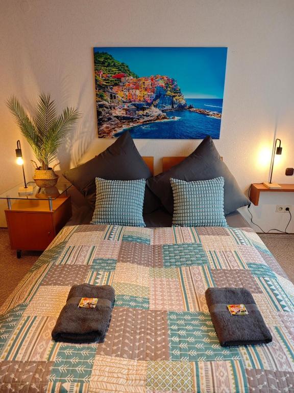 a bedroom with a large bed with two towels on it at Linnich Apartment für 4 Personen mit Küche in Linnich