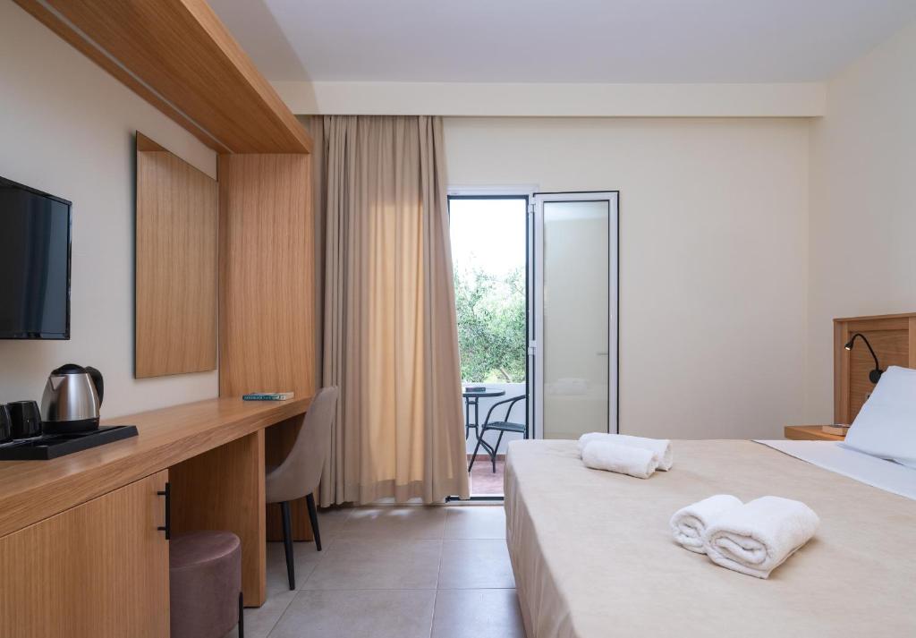 Postel nebo postele na pokoji v ubytování Calypso Hotel