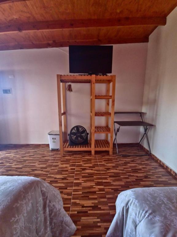 Postel nebo postele na pokoji v ubytování Hostal Perita