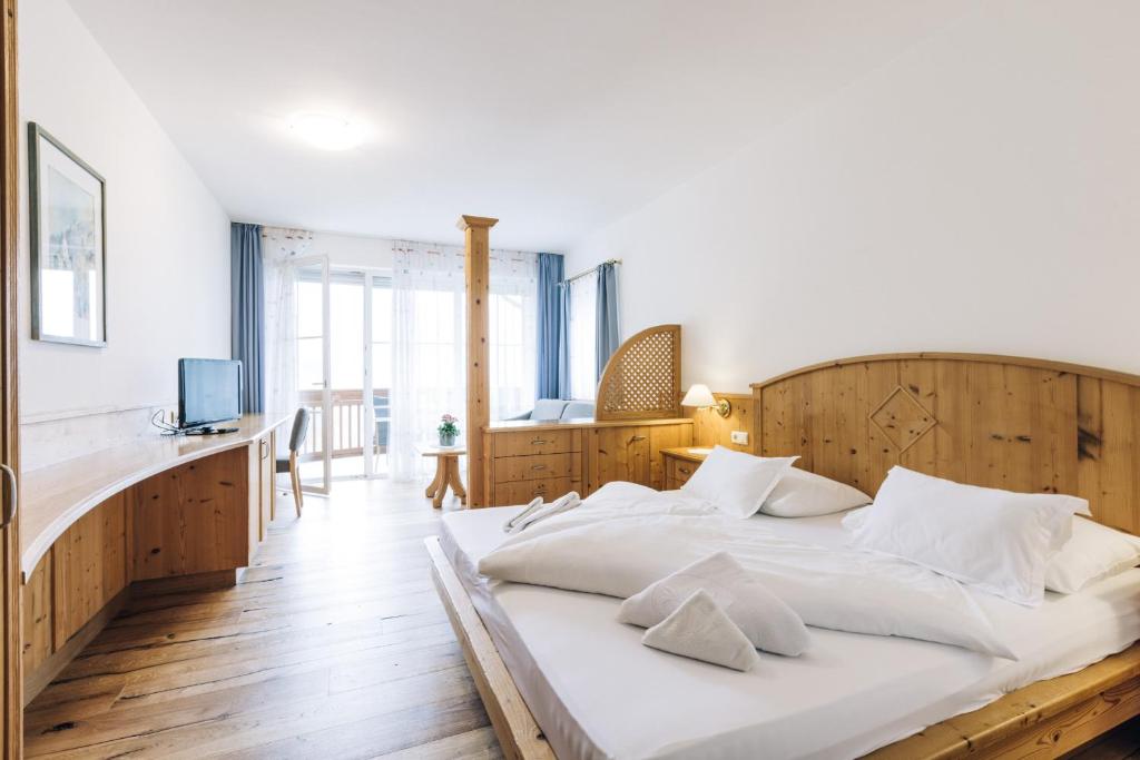 Posteľ alebo postele v izbe v ubytovaní Hotel Tenz