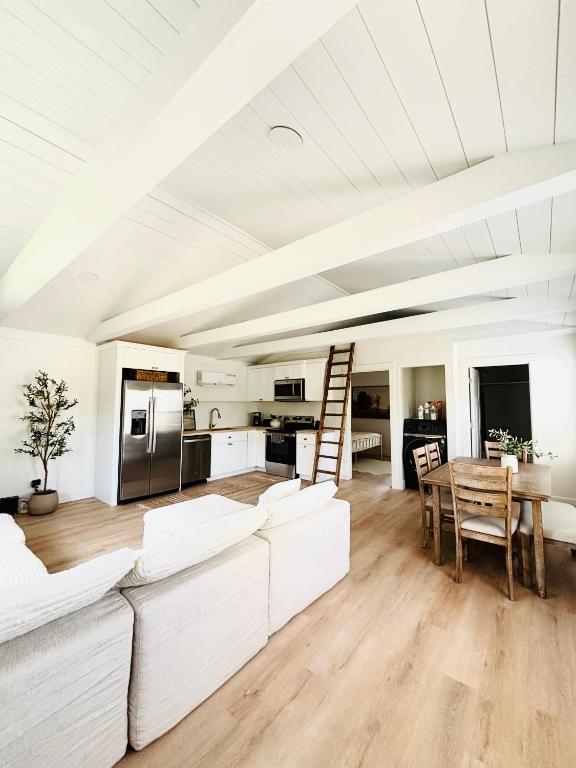 a living room with white furniture and a table at Luxury BoilingSprings Getaway in Boiling Springs