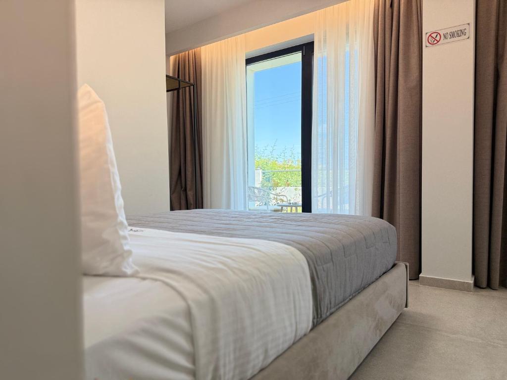 Postel nebo postele na pokoji v ubytování Malka Premium Suites
