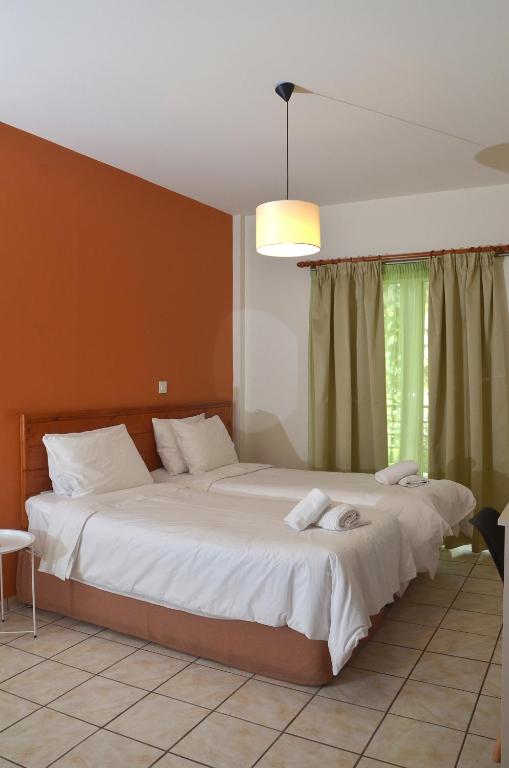 Postel nebo postele na pokoji v ubytování Centroom Suites