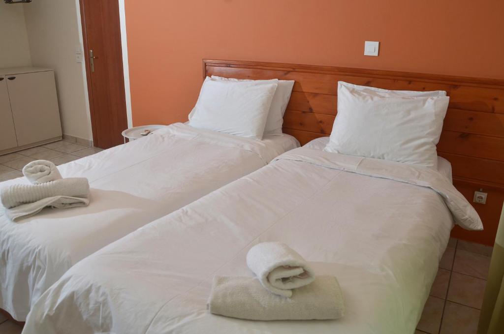 Postel nebo postele na pokoji v ubytování Centroom Suites