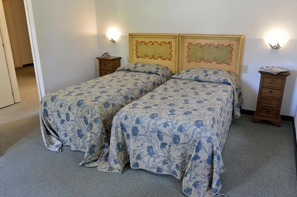 Postel nebo postele na pokoji v ubytování Hotel Calzaiolo