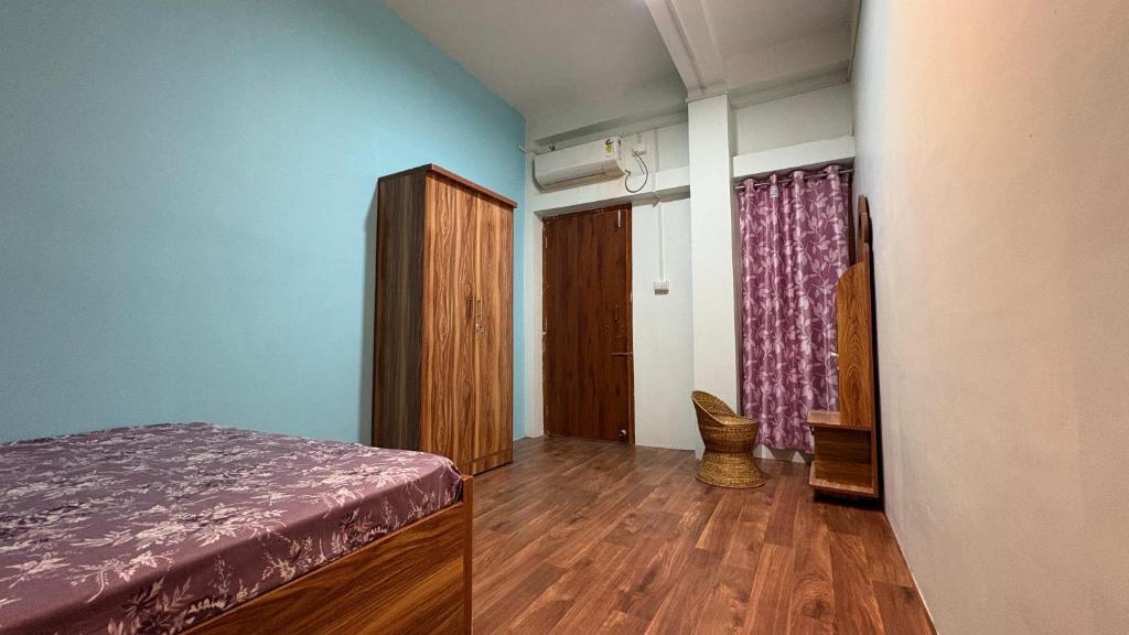 Postel nebo postele na pokoji v ubytování Sangita Homestay