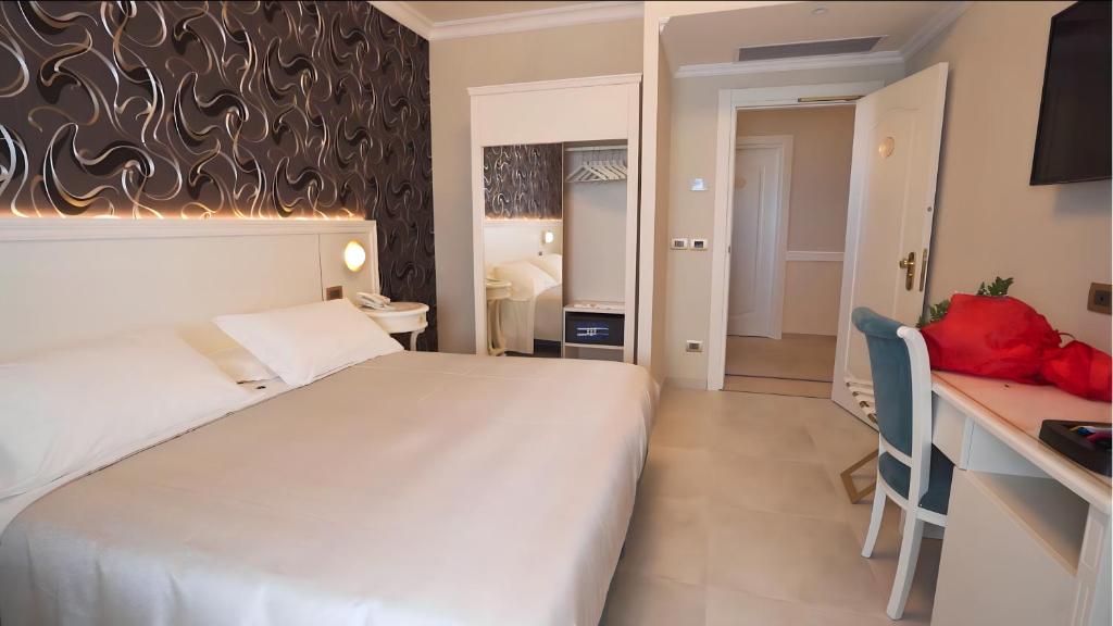 Postel nebo postele na pokoji v ubytování Hotel Sicilia