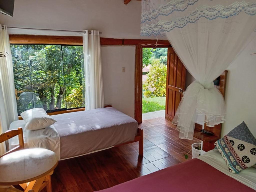 Ένα ή περισσότερα κρεβάτια σε δωμάτιο στο Eco Terra Lodge