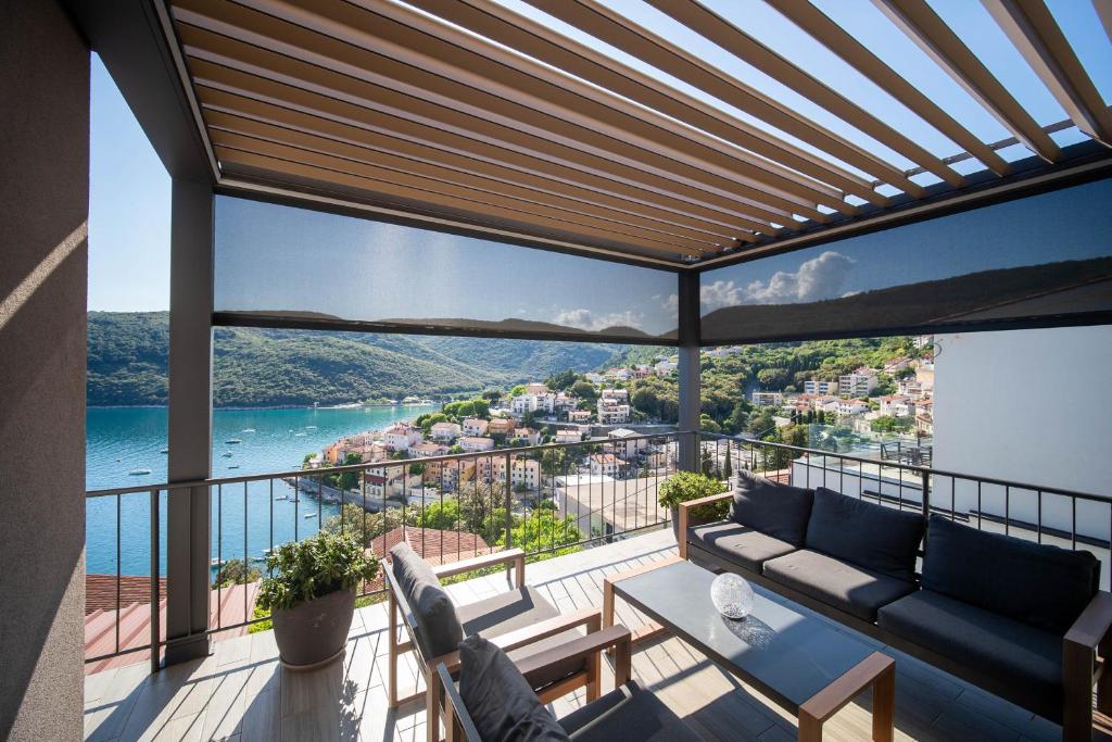 a balcony with a view of the ocean at Apartment Stella in Rabac