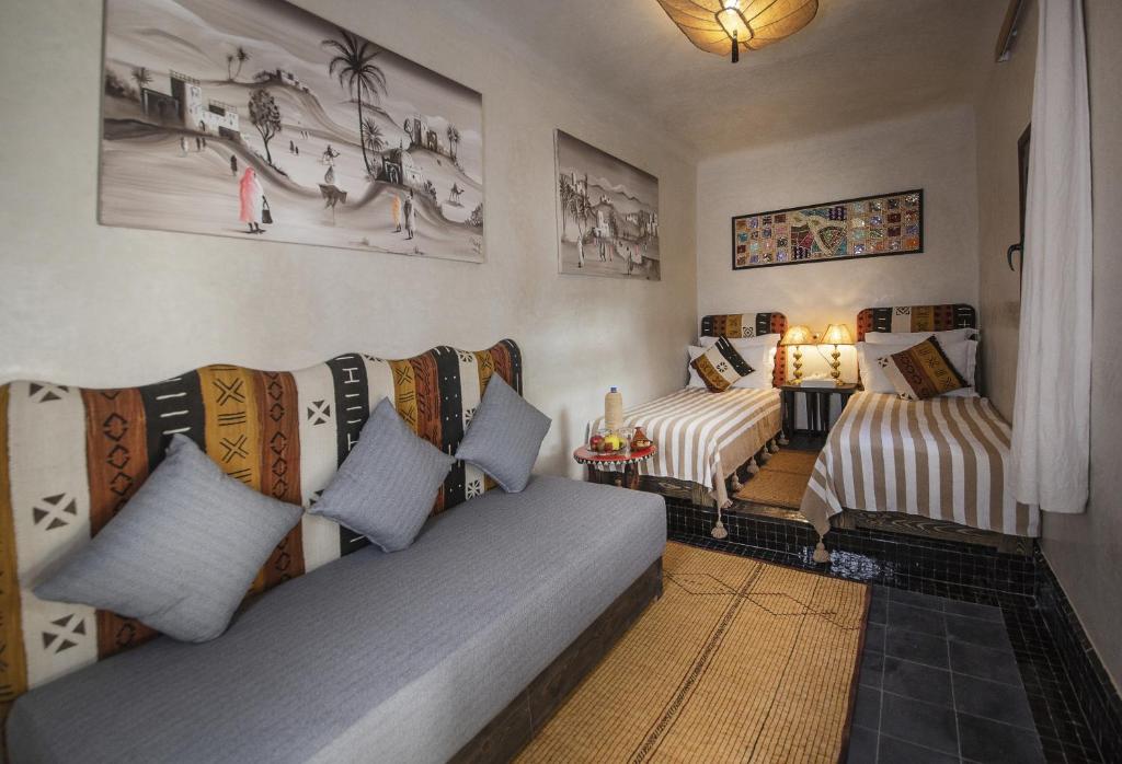 Postel nebo postele na pokoji v ubytování Riad Casa Felicità & SPA