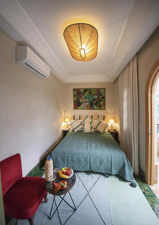 Postel nebo postele na pokoji v ubytování Riad Casa Felicità & SPA
