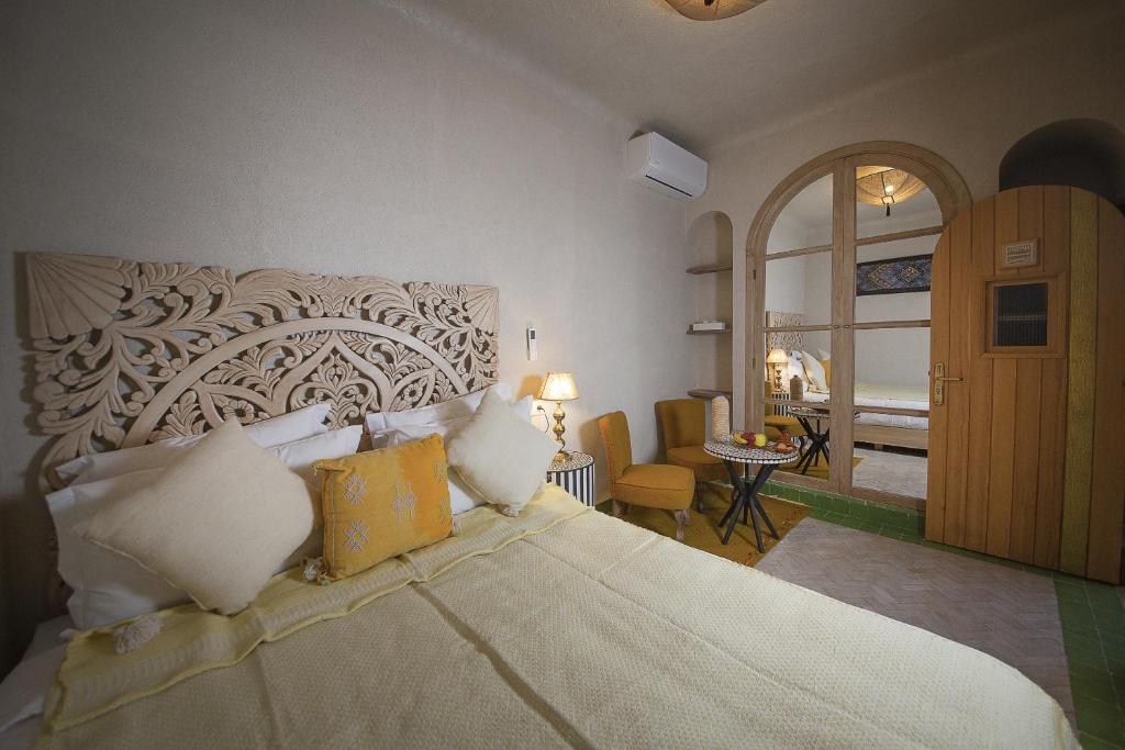Postel nebo postele na pokoji v ubytování Riad Casa Felicità & SPA