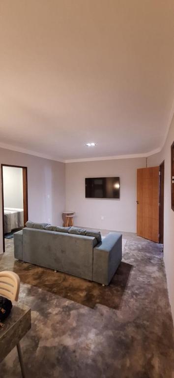 a large bedroom with a large bed in a room at Casa Fundo de Quintal in Baía Formosa