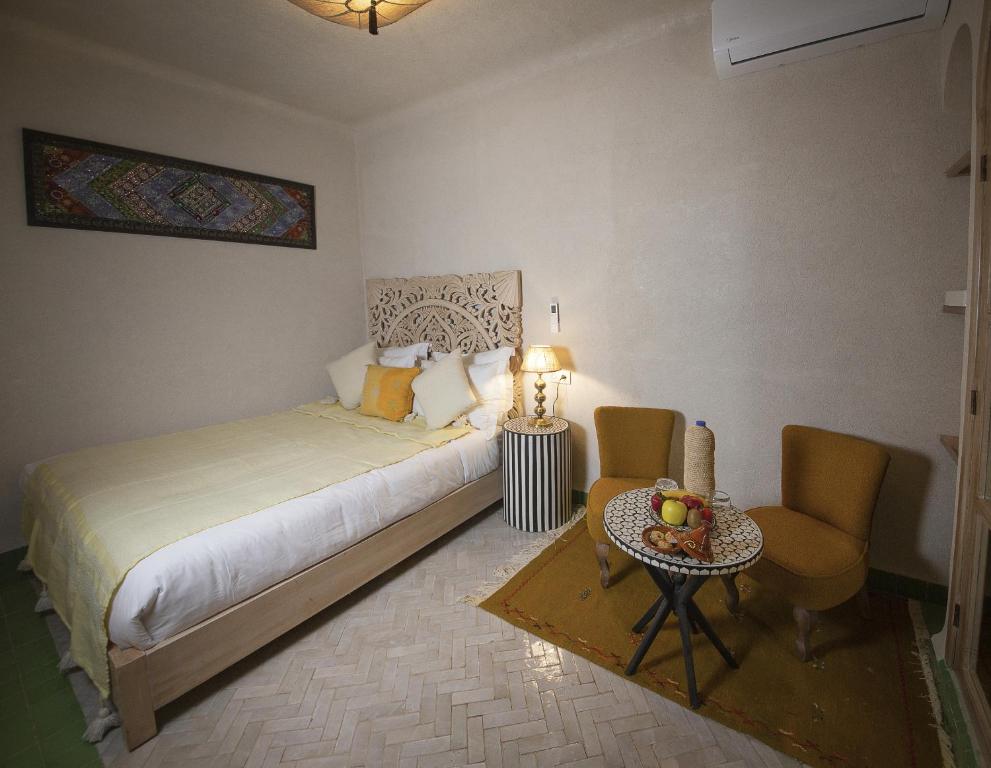Postel nebo postele na pokoji v ubytování Riad Casa Felicità & SPA