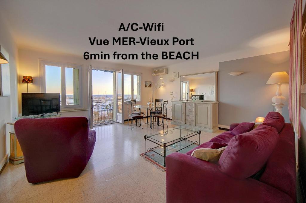 un salon avec un canapé rouge et une table dans l'établissement Spacieux 2 Pièces Vue panoramique sur Port de Cannes A1B47, à Cannes