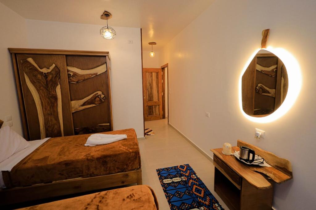 Postel nebo postele na pokoji v ubytování Kaya Nubian House