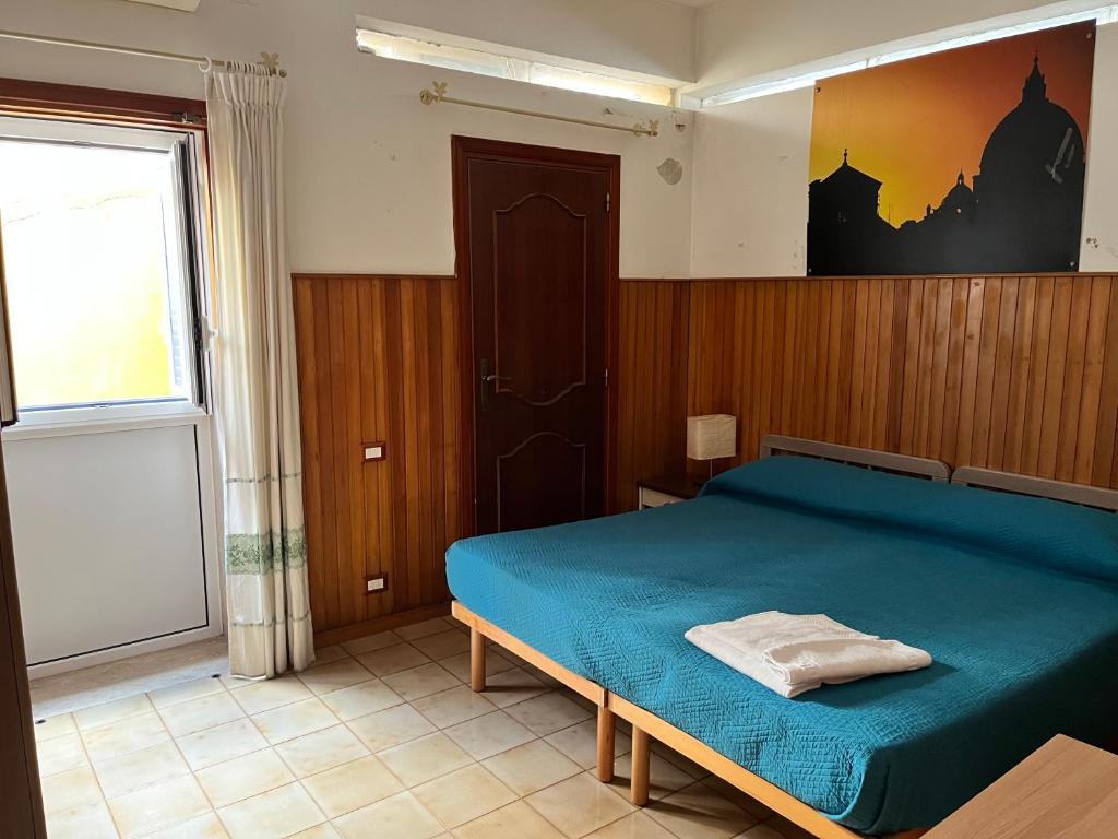 Posteľ alebo postele v izbe v ubytovaní Domus Getsemani