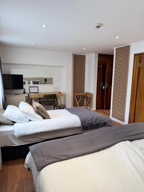 Postel nebo postele na pokoji v ubytování Hotel Astra