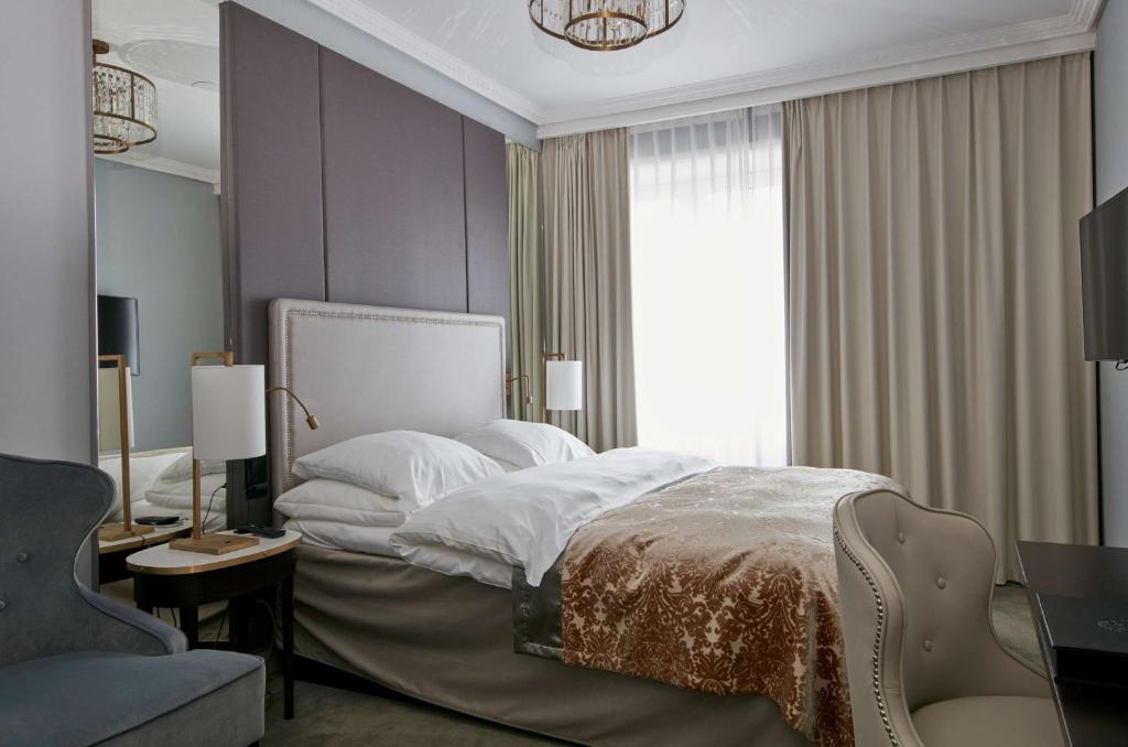 Postel nebo postele na pokoji v ubytování Grand Hotel Oslo