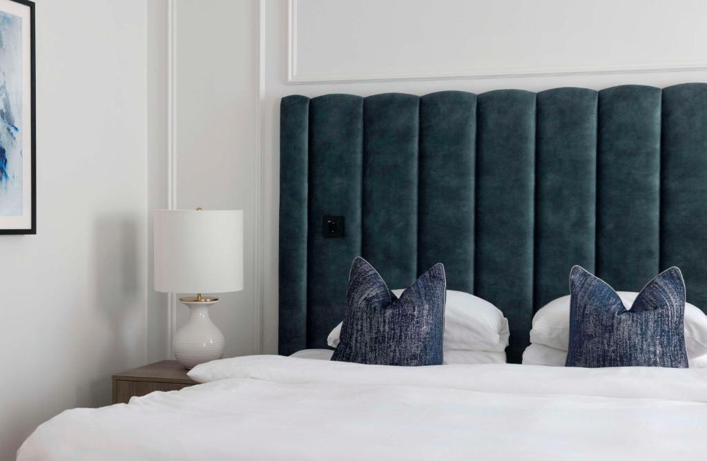 Postel nebo postele na pokoji v ubytování Grand Hotel Oslo